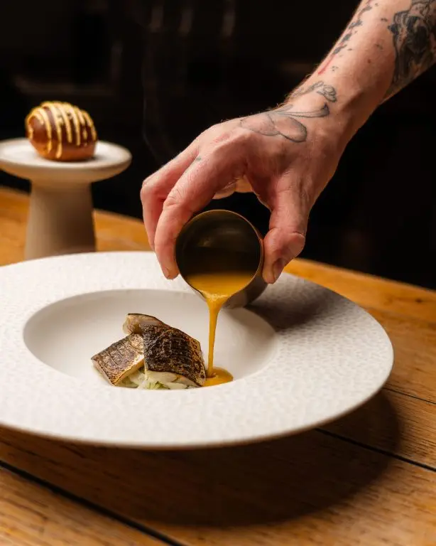 Lightly cured & torched mackerel, fennel salad, spiced fish soup, red pepper rouille, garum, roasted fennel, char-siu bun Lightly cured & torched mackerel, fennel salad, spiced fish soup, red pepper rouille, garum, roasted fennel, char-siu bun