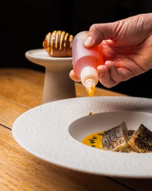 Lightly cured & torched mackerel, fennel salad, spiced fish soup, red pepper rouille, garum, roasted fennel, char-siu bun Lightly cured & torched mackerel, fennel salad, spiced fish soup, red pepper rouille, garum, roasted fennel, char-siu bun