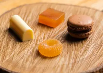 Petit fours - dark chocolate macaron, white chocolate lemon, yuzu pastille, pate de fruits