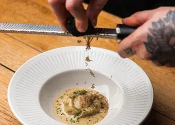 Wild mushroom & egg yolk raviolo, cep vinaigrette, wilted spinach, mushroom sauce, truffle